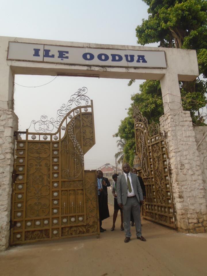 The entrance gate of Ile Oodua palace, with the name inscribed above the ornate metal doors.